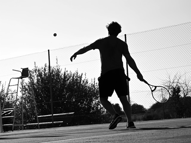 Community tennis court with diverse players